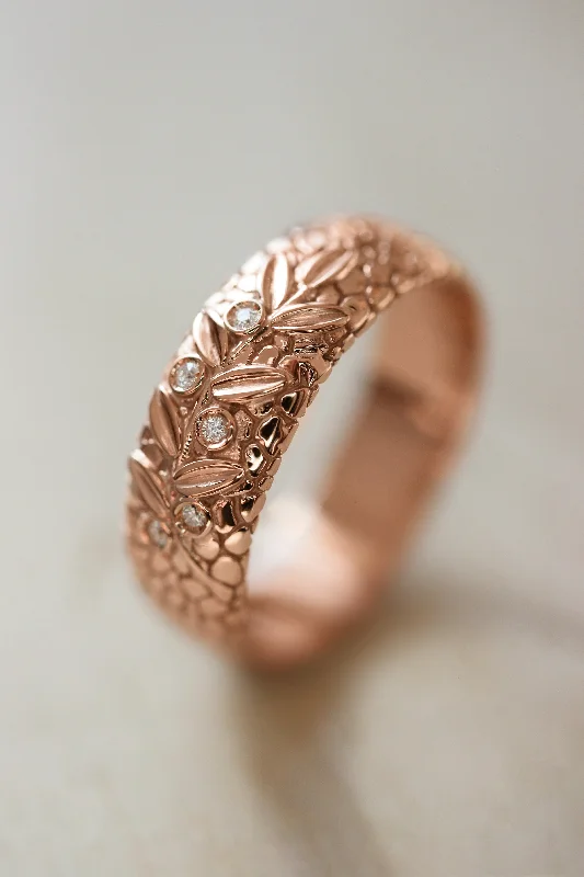 Textured wedding band with olive branch and diamonds